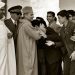 (FILES) A picture taken on January 27, 1958 shows Moroccan King Mohammed V (C) hugging a student as Education Minister Mohammed El Fassi looks on during King's visit to Moulay Idriss High school in Fez where he attends the UNESCO Congress of Arab states. AFP PHOTO