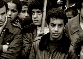 People participate in a silent protest, on November 10, 1982 in Nanterre to pay homage to young Moroccan Abdennbi Guemiah killed by a bullet from a suburban house, on November 06. AFP PHOTO PHILIPPE BOUCHON / AFP PHOTO / PHILIPPE BOUCHON