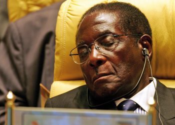 Zimbabwe's President Robert Gabriel Mugabe closes his eyes during the Africa Union meeting in Sirte, Libya July 4, 2005. Buoyed by a surge of global goodwill, Africa kept pressure on the rich world on Monday with its leaders readying a call for fairer trade and debt cancellation in the fight against poverty. A gathering of the 53-nation African Union (AU) in Libya which opened on Monday will agree a message to send to a summit of the Group of Eight (G8) rich nations in Scotland later this week about rescuing the continent of 800 million from poverty, war and disease. REUTERS/Radu Sigheti PP05070216  RSS/KI - RP6DRNARGVAA